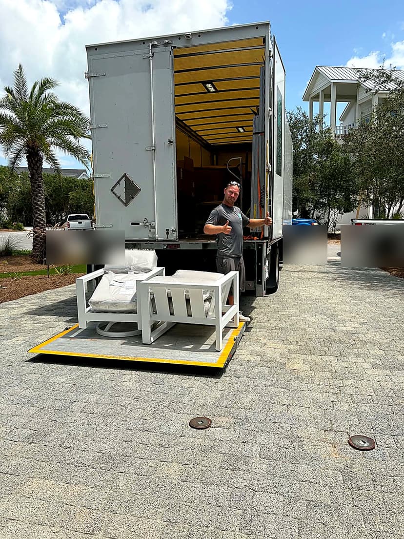 Beach House Moving crew delivering outdoor furniture to a beachfront home in Seacrest Beach, FL