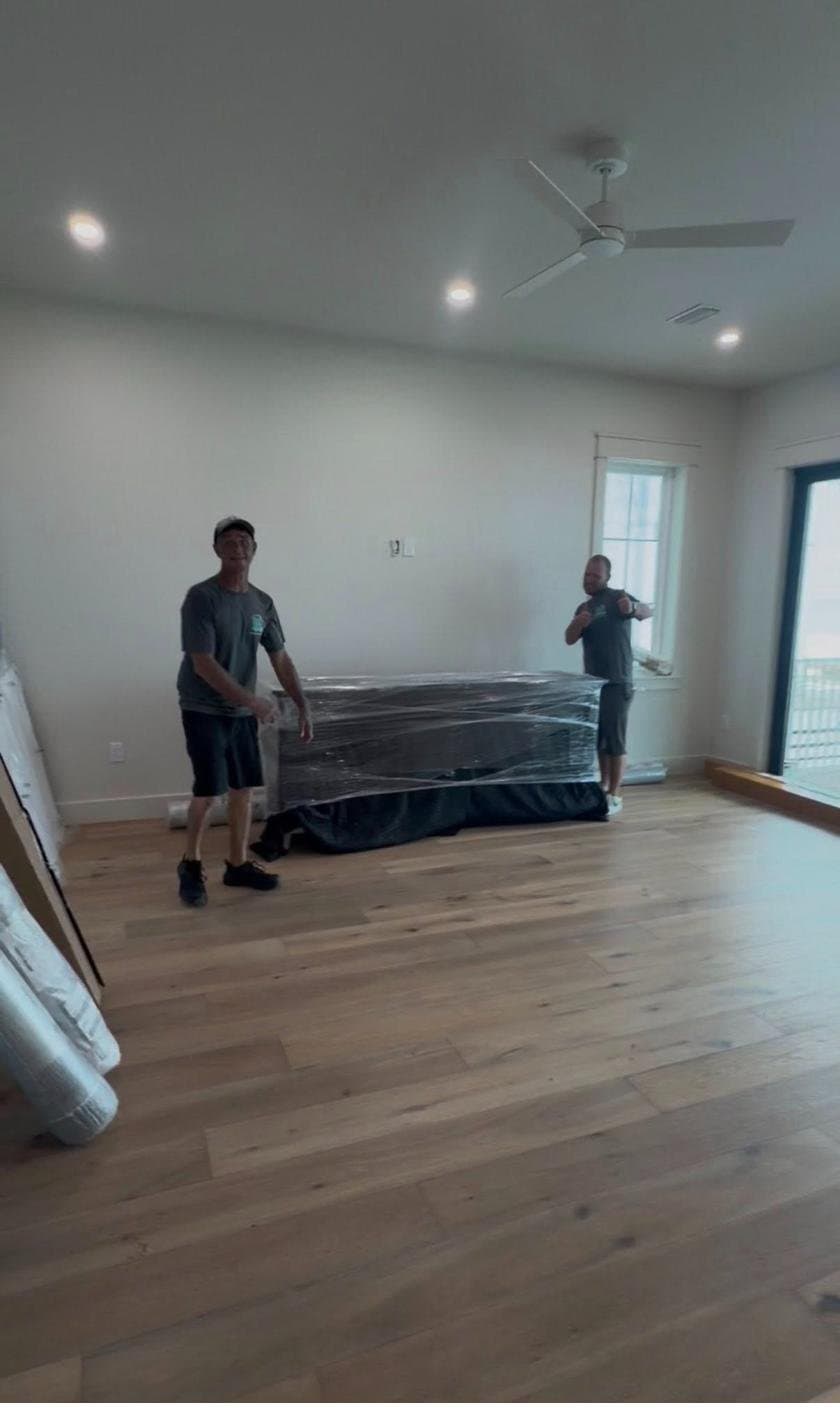 Furniture wrapped and protected for transport by Beach House Moving